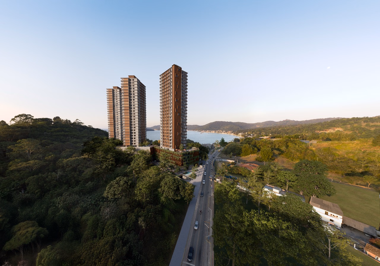 As três torres ao entardecer, sobre a mata e a avenida