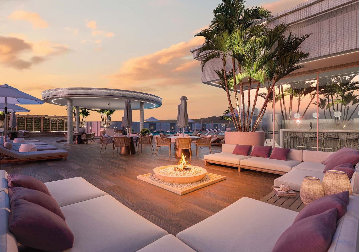 Lounge da cobertura do Ametista Home Club ao pôr do sol, com vista para Itapema