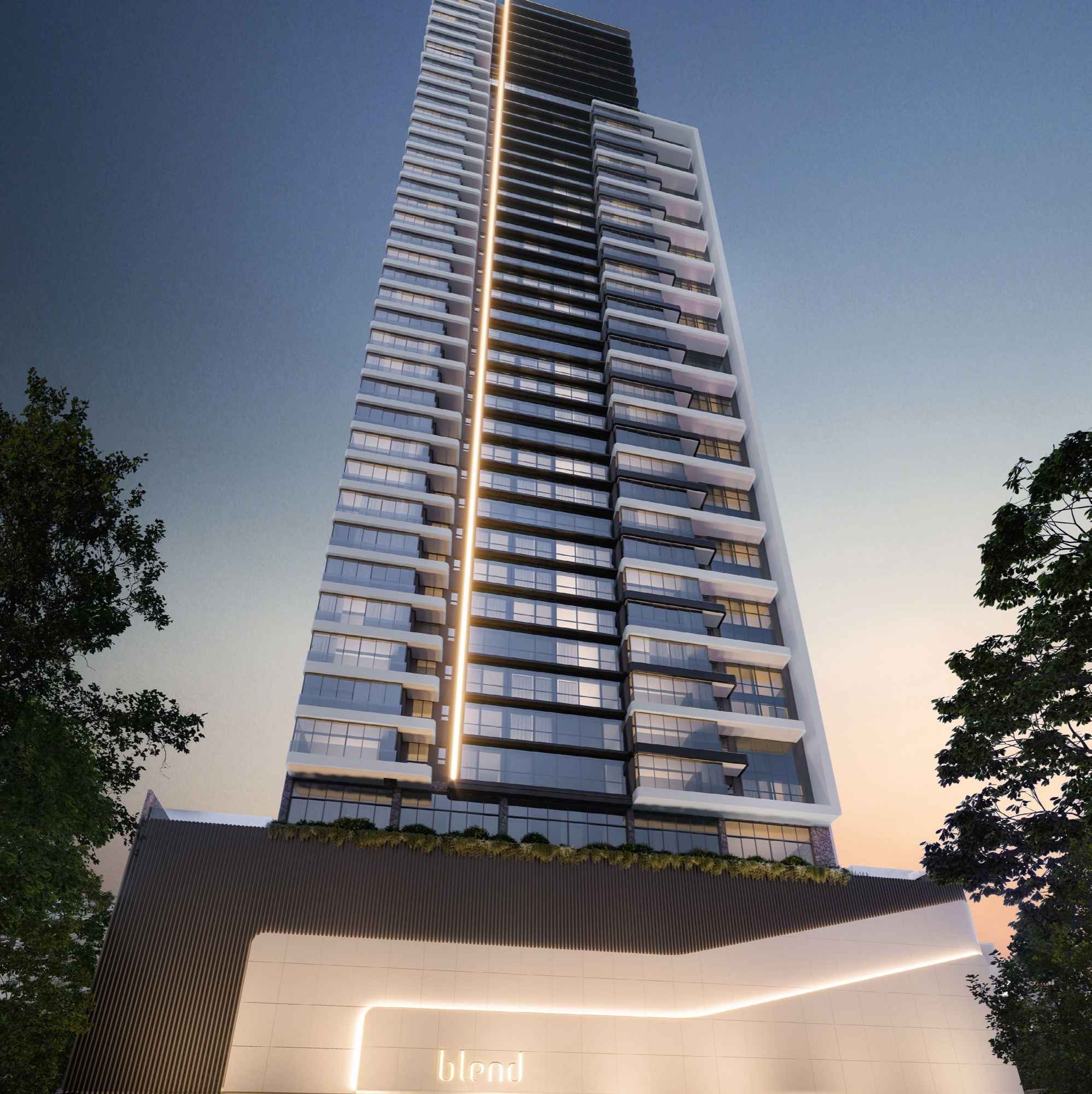 Fachada iluminada da torre do Blend Apartments na Meia Praia, Itapema, à noite