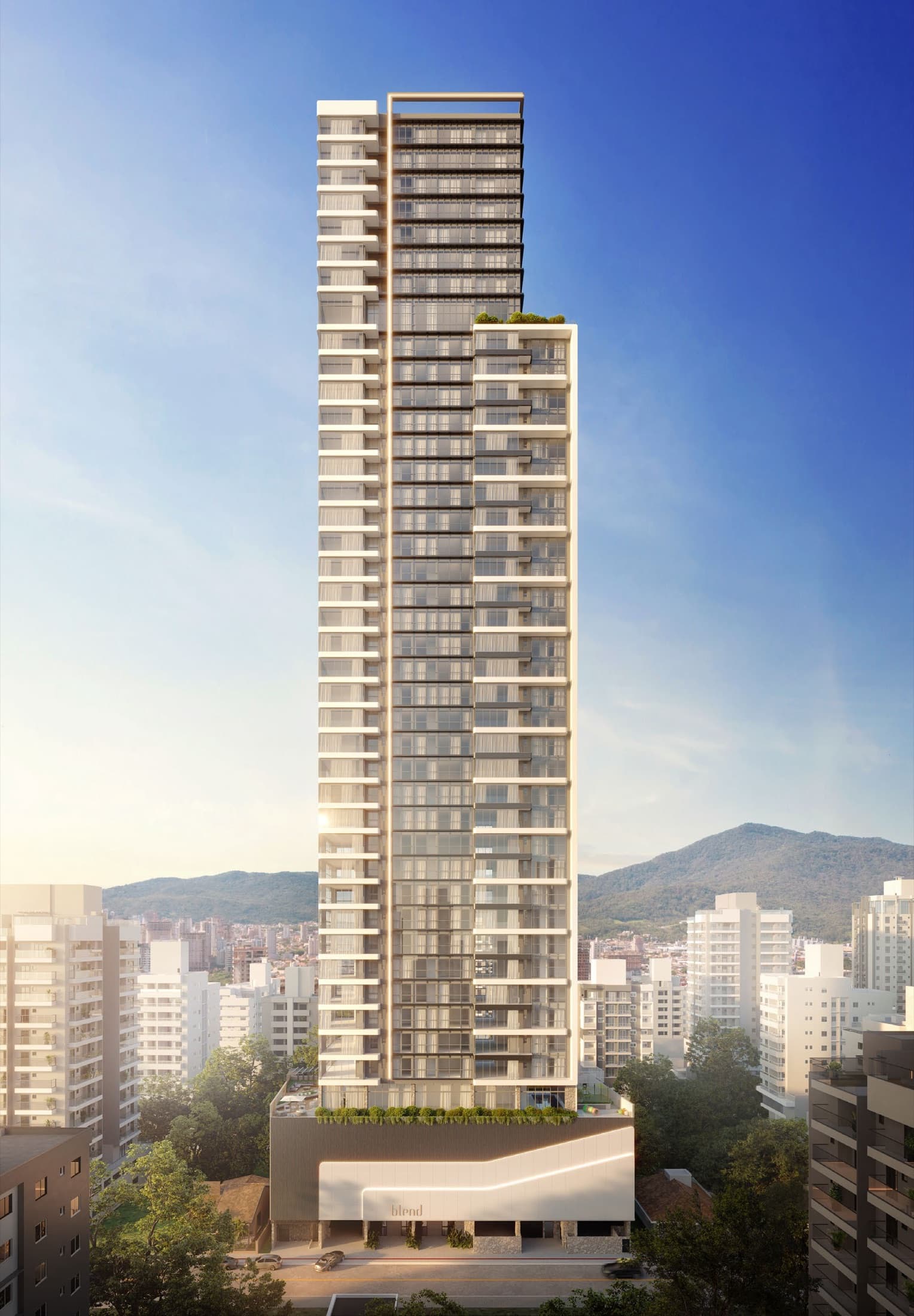 Torre completa do Blend Apartments, 44 pavimentos, emoldurada pelas montanhas e pelo skyline de Itapema