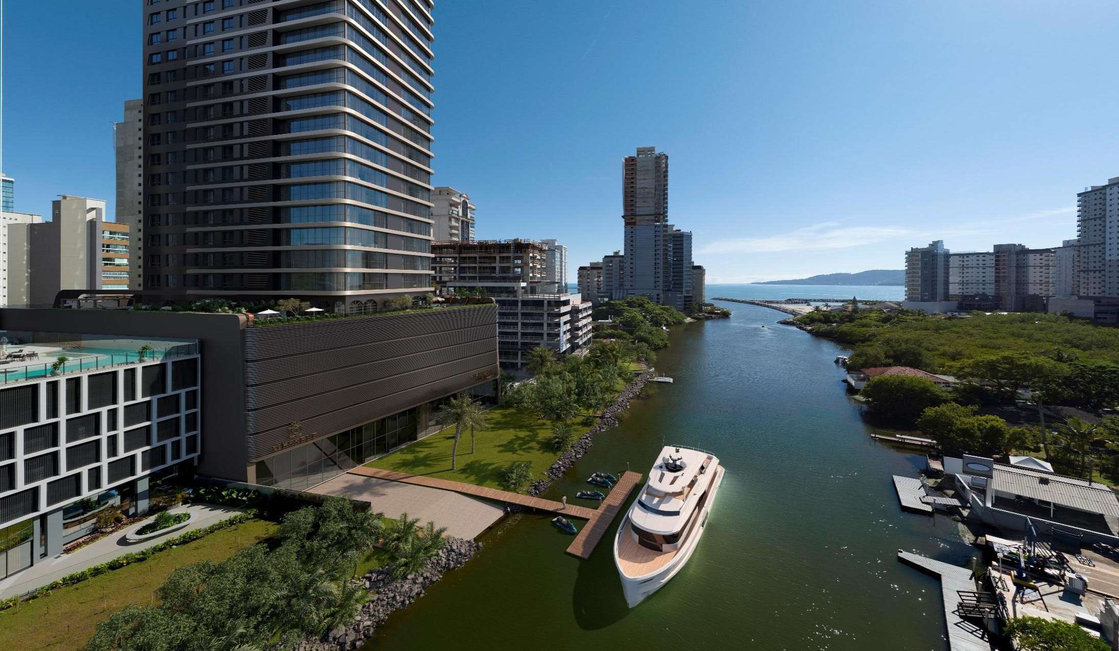 Vista aérea do Charles II Yacht Royal Home — torre com marina privada e yacht no canal navegável de Meia Praia, Itapema/SC