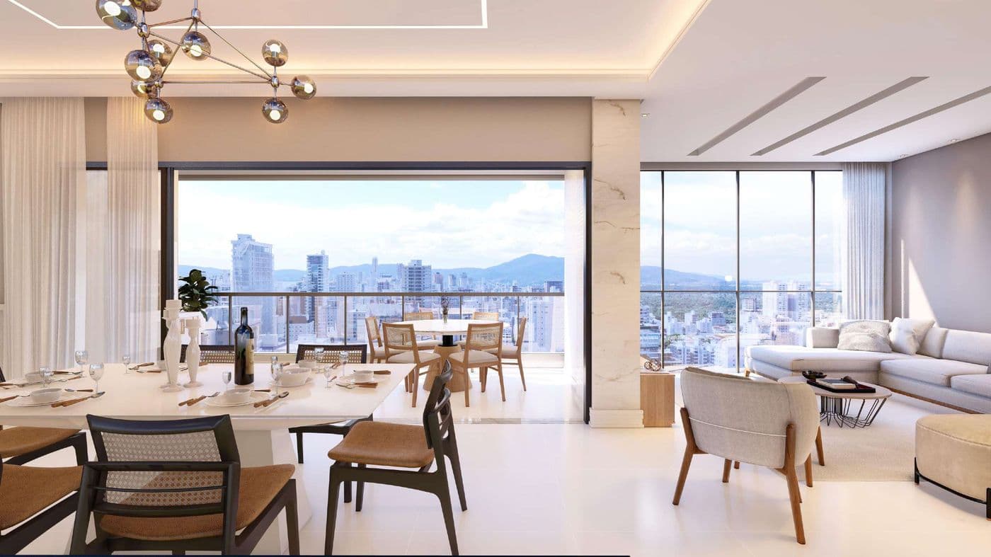 Sala de jantar e living de um apartamento do Edir Russi Dellagnelo Residence, na Meia Praia