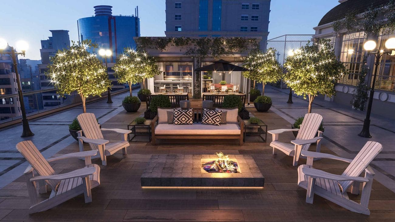 Outdoor grill com praça de fogo do L'Atelier Concept Home, na Meia Praia