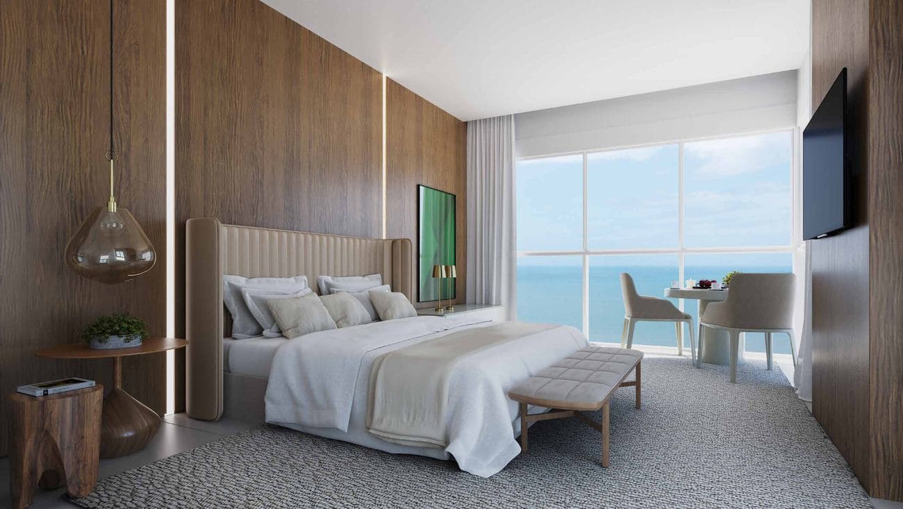 Suíte deluxe de 55,64 m² do penthouse do L'Atelier Concept Home, com vista para o mar