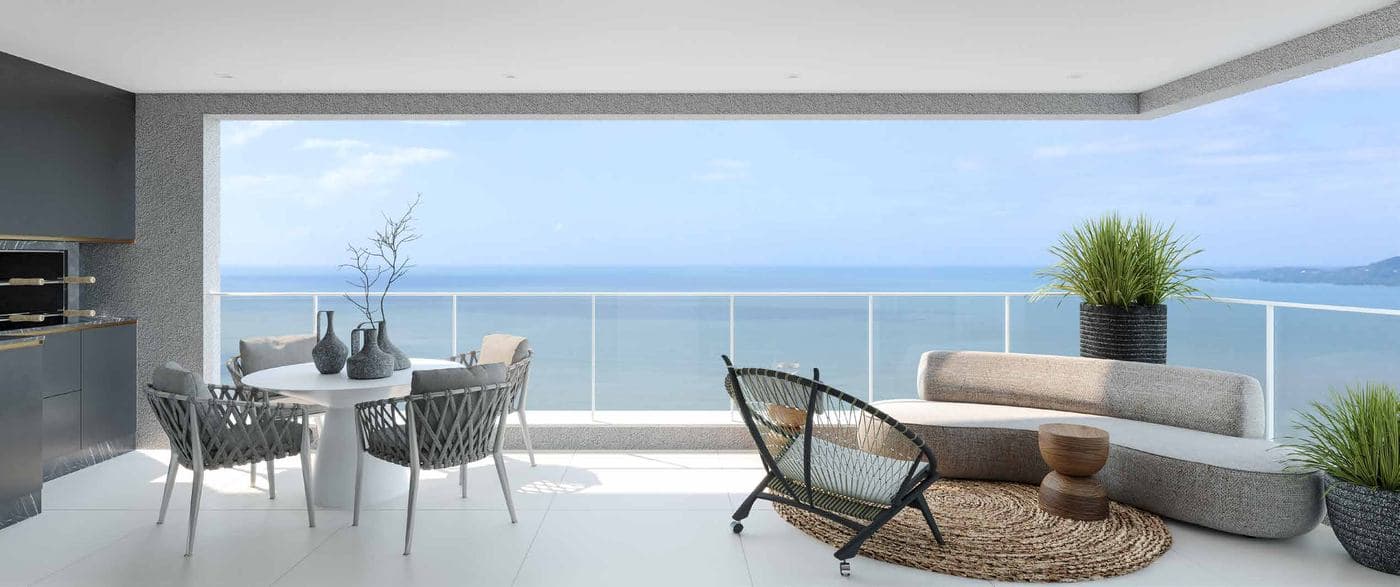Varanda com churrasqueira a carvão e vista para o mar do L'Atelier Concept Home