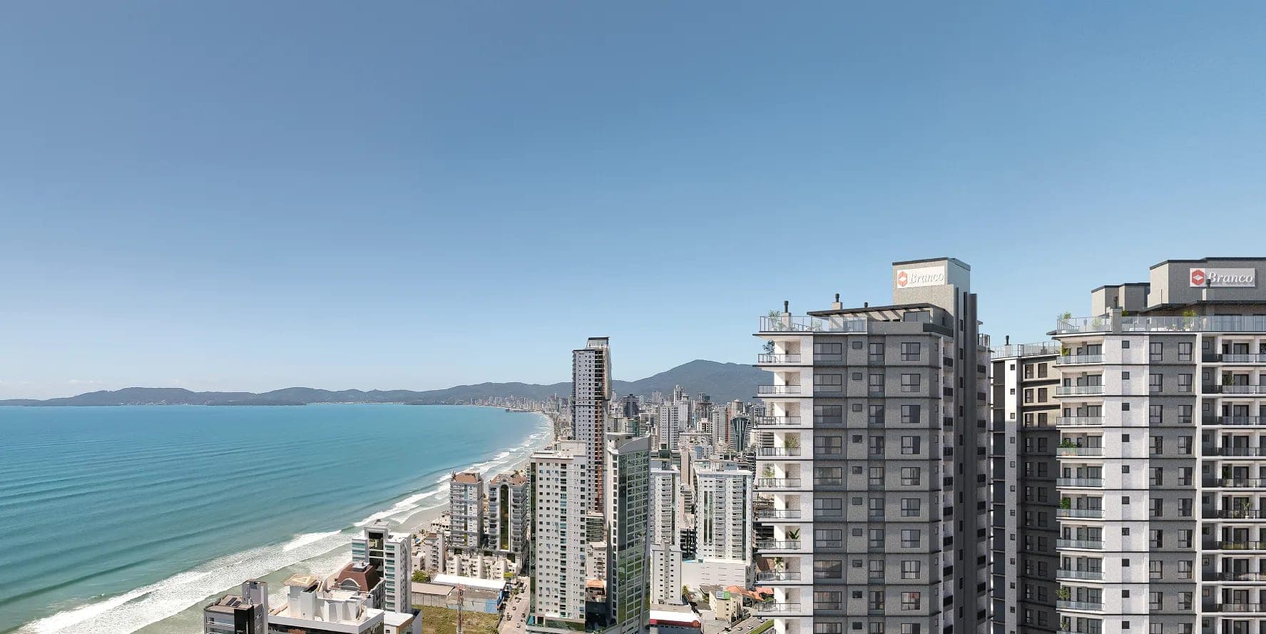 As torres do Onix Towers Residence com a orla de Itapema ao fundo