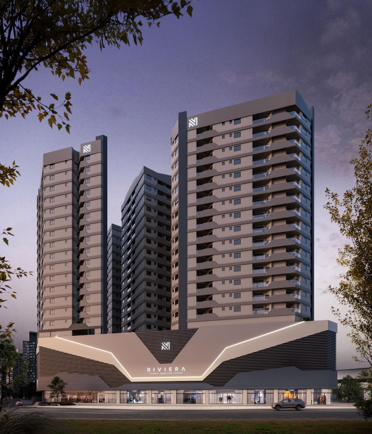 Torres do Riviera Home Club ao anoitecer, com o embasamento iluminado
