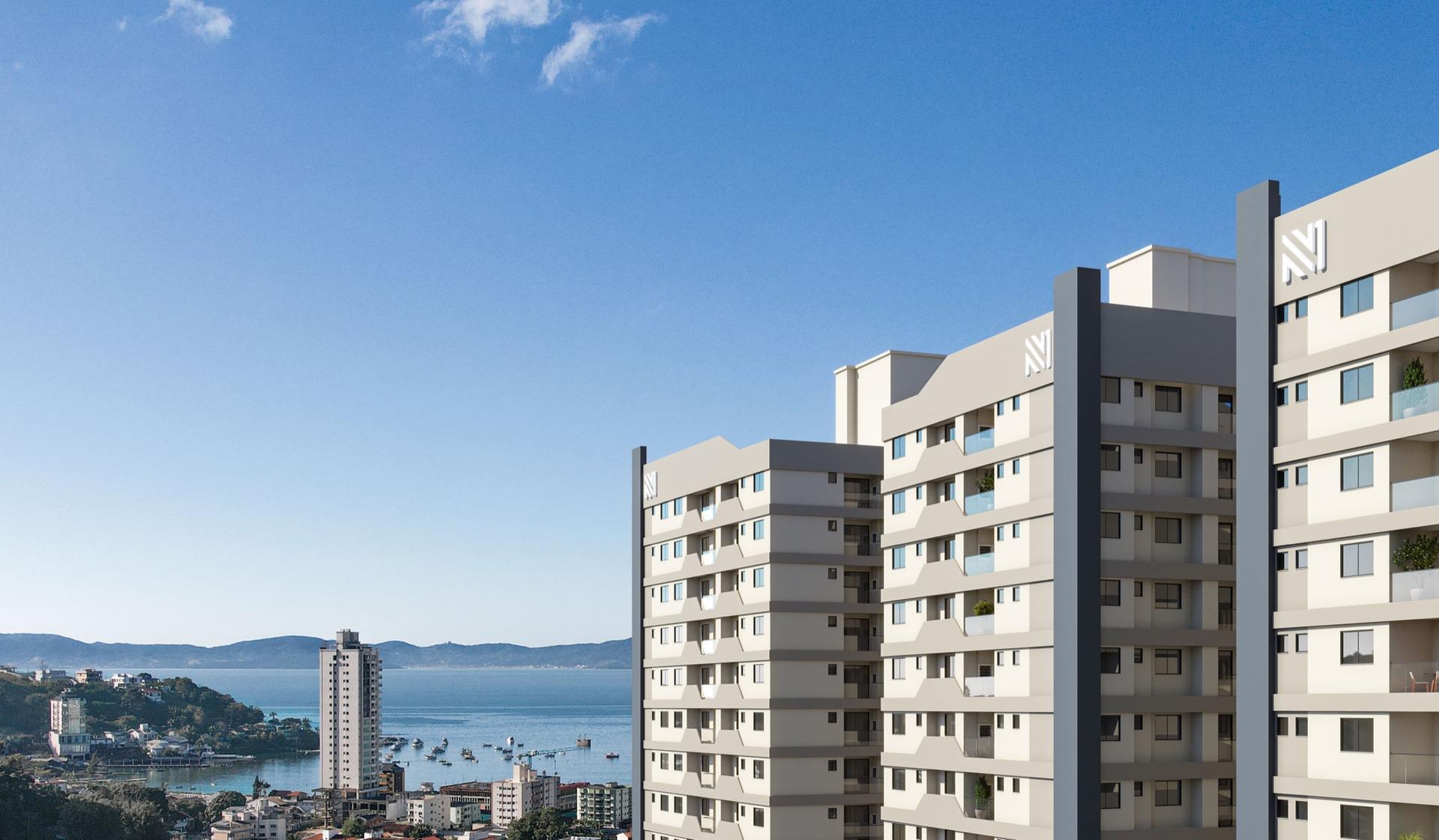 Torres do Riviera Home Club em Itapema, com o mar e os morros da baía ao fundo