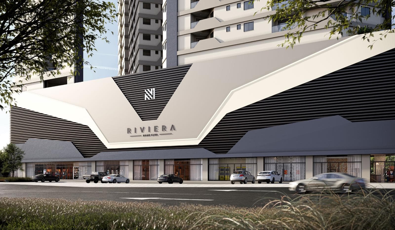 Embasamento do Riviera Home Club visto da rua, com a marca do empreendimento na fachada