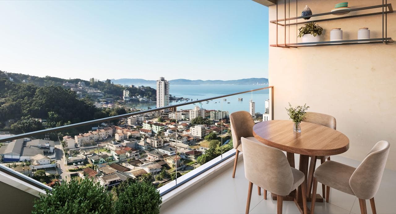 Sacada com mesa do apartamento tipo 04 da Torre Vernazza do Riviera Home Club