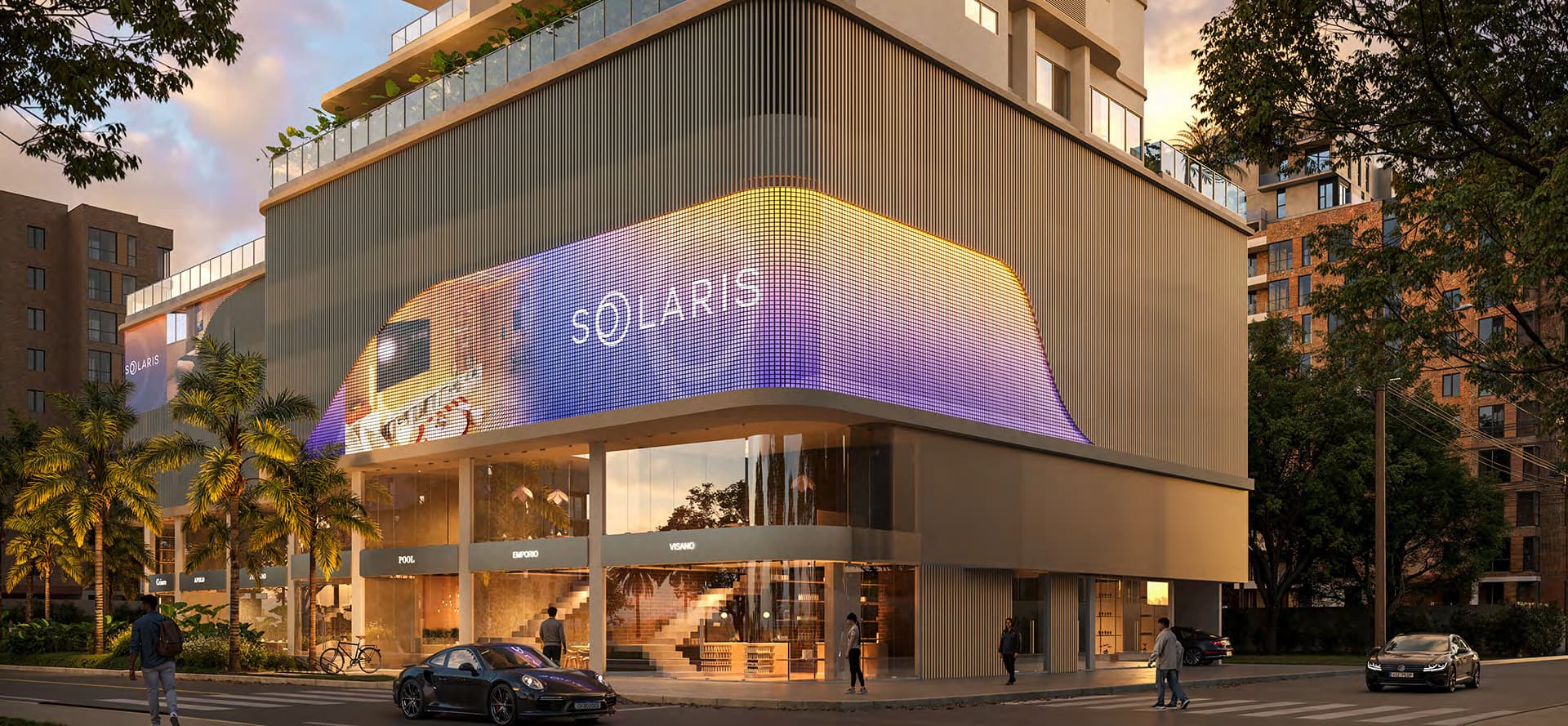 Fachada iluminada do Solaris Residencial à noite, em Meia Praia, Itapema