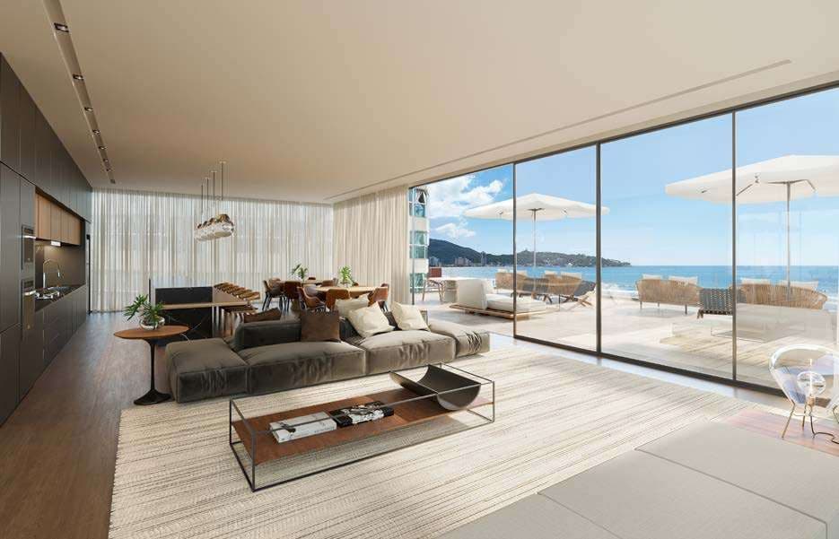 Living de apartamento do Sunny Coast com vista frontal para o mar de Itapema